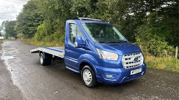 Car being loaded onto transport